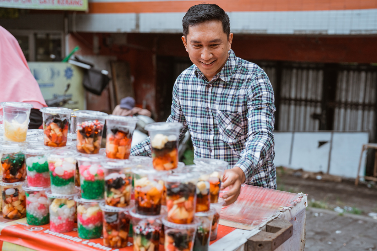 street food vendor sell fruit beverage on plastic cup